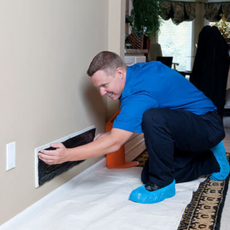 Air duct services professional replacing a residential air duct
